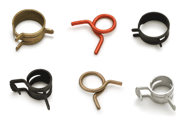 Display of a variety of Rotor Clip hose clamps in different materials, including stainless steel, showcasing diverse sizes and designs for multiple application needs